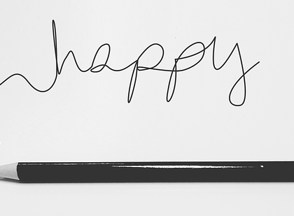 Napis happy i ołówek